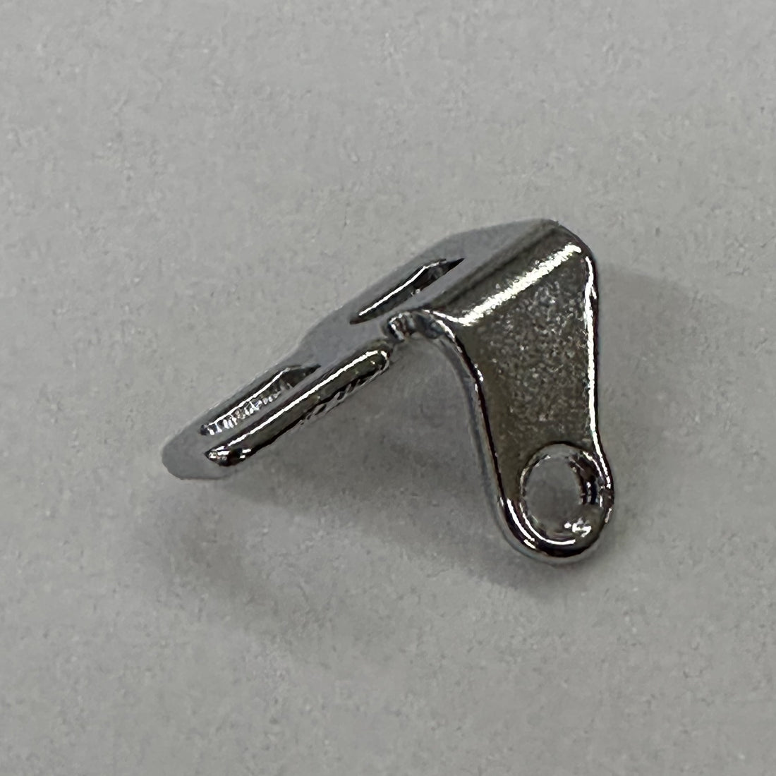 JUKI 13208707 Needle Thread Guide Base, photo 1 of 6