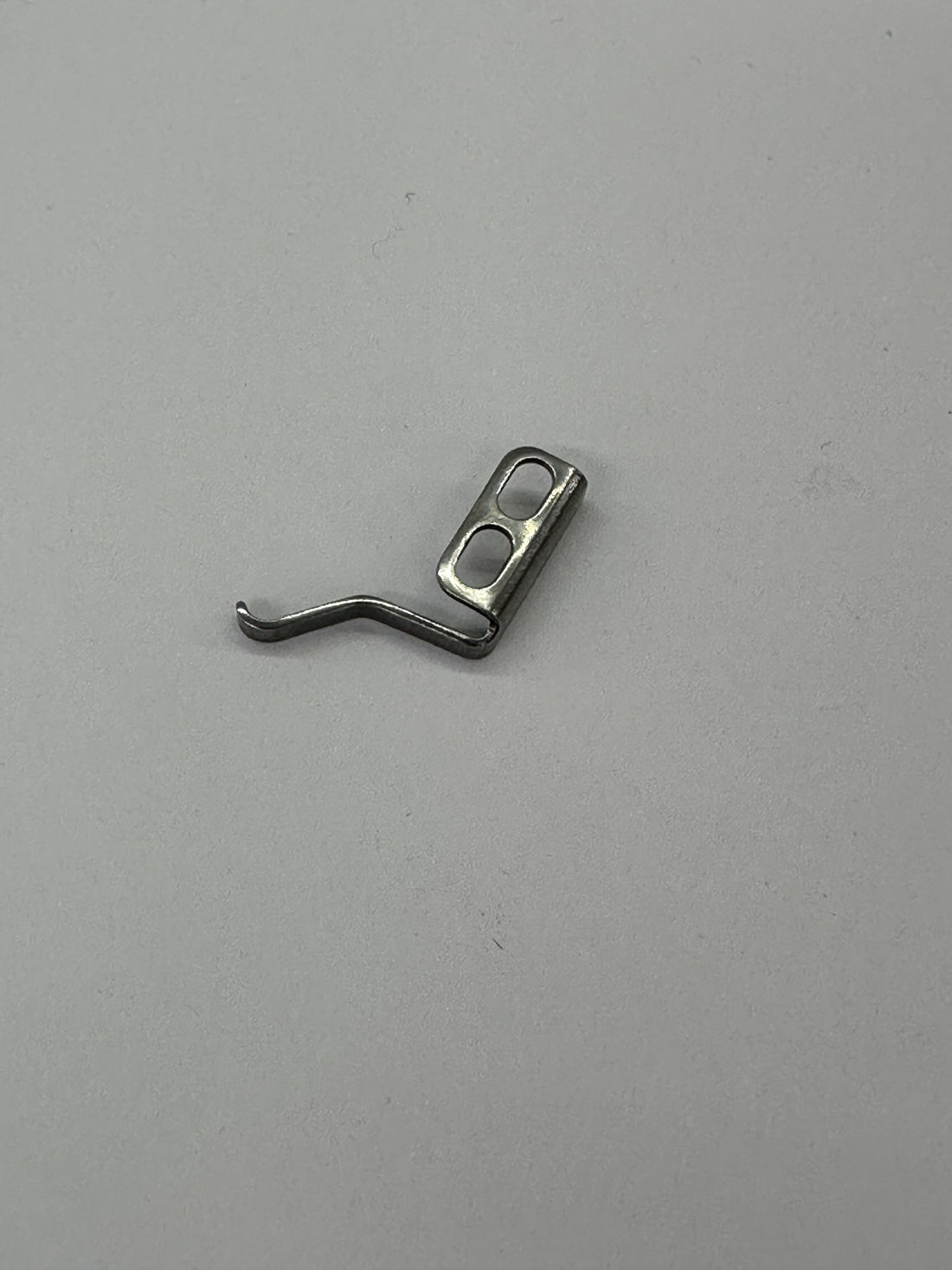 JUKI 21389408 Clamp Spring, photo 1 of 4
