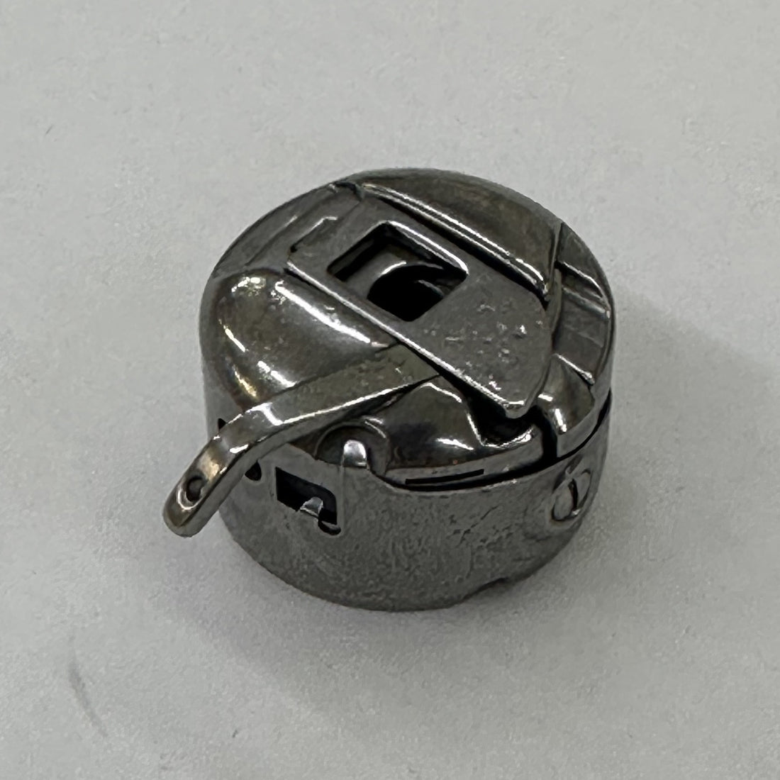 JUKI B18289800BB Bobbin Case Assembly (Racing Prevention), photo 1 of 6